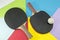 Pair of table tennis rackets on a collage background