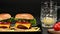 Pair of tasty beef burgers and a mug with beer