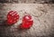 Pair of thrown red dices on wooden table