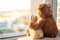 Pair of toys. Bunny and teddy bear  Embracing loving teddy bear toy and bunny sitting on window-sill