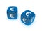 Pair of translucent blue dice with euro sign