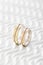 Pair of two tone gold wedding rings with wave design