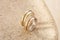 Pair of two tone gold wedding rings with wave design