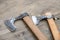 Pair of viking battle axes close up on wooden background