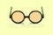 Pair of vintage reading spectacles on yellow background