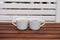 A pair of white Cups of Turkish coffee on striped wooden table. Side View