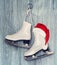 Pair of White Ice Skates and Santa Claus hat - backround on vintage style
