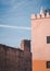 Pair of White Storks on a stick nest and ruined building of Badi palace in the medina of Marrakech Morocco, North Africa