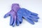 A pair of women\'s blue and purple gardening gloves on white