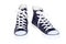 Pair of women`s high top lace up dark navy blue sneakers isolated on white background