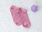 Pair of women socks on pink background