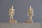 Pair of wooden human figures standing on blocks with the text Social Distance