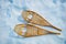 Pair of the wooden snowshoes in snow view from above