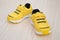 Pair of yellow sporty shoes for kid