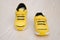 Pair of yellow sporty shoes for kid