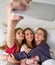 Pajama party best friend girls selfie at bed