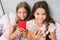 Pajamas party concept. Girlish leisure happy childhood. Girls long hair with smartphones use modern technology. Lets