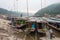 Pakbeng, Laos - Mar 04 2015: Slow boats at Mekong River in Pakbeng village. The village is the major stop for boats running