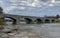 Pakenham Bridge, a five span stone bridge that crosses the Mississippi River on a cloudy autumn day in Pakenham, Canada