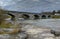 Pakenham Bridge, a five span stone bridge that crosses the Mississippi River on a cloudy autumn day in Pakenham, Canada