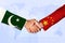 Pakistan and China Friendship concept Background with businessman shaking hands. Investment and business