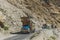 Pakistani decorated trucks transport goods via Karakoram highway, Pakistan.