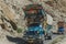 Pakistani decorated trucks transport goods via Karakoram highway, Pakistan.