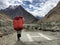 Pakistani male porter walk pass helicopter landing pad in mountain area