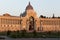 Palace of Agriculture with a bronze tree in the sunset in Kazan