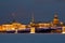 Palace bridge, Admiralty and St. Isaac`s Cathedral, evening in February. View from the frozen Neva river. Saint-Petersburg