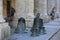 Palace of Captain-Generals. Colonnade and old bells on the sidewalk