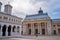 Palace of the Patriarchate and Patriarchal Cathedral of Saints Constantine and Helena, with dark storm clouds gathering above.