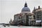 The palaces and historical houses from the Grand Canal, Venice, Italy . The coupol of Salute church over the roofs.