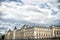 Palais de la Cite in Paris, France. Palace building with towers on cloudy sky. Monument of gothic architecture and design. Vacatio