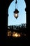 Palais royal gardens arcade lamppost light at sunset in Paris