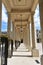 The Palais Royal, view of corridor, columns and hanging lamps in the courtyard. Paris, France.