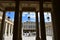 The Palais Royal, view of corridor, columns and hanging lamps in the courtyard. Paris, France.