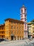 Palais Rusca Palace and Tour de l\\\'Horloge clock tower at Place du Palais de Justice Palace square in Nice in France