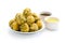 Palak OR Methi Pakora is an Indian Snack served with Green mint chutney and red Sauce  selective focus