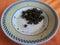 Palak Saag served in a ceramic plate on orange background