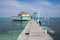 A palapa bar at the end of a dock in Belize