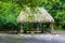 Palapa hut house cabin in tropical jungle Coba ruins Mexico