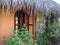 Palapa roof and picturesque window in an echo village