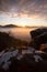Palatinate Forest, sandstone cliffs with a view of the sunrise in the valley is fog