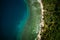 Palawan, Philippines, El Nido. Aerial drone top down view of a secluded deserted tropical beach with coconut palm trees