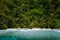 Palawan, Philippines, El Nido. Aerial drone view of a secluded deserted tropical beach with lonely tourist boat in frost