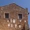 The Palazzo Pretorio in Sovana, Grossetto, Italy. With ancient bas-reliefs.