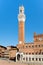 The Palazzo Publico at Piazza del Campo on the city of Siena, Italy