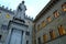 Palazzo Salimbeni in Siena. Headquarters of the Monte dei Paschi di Siena bank with a statue of Sallustro Bandini in Piazza