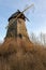 Palczewo, pomorskie / Poland Ã¢â‚¬â€œ December, 11, 2019: Old destroyed wooden Dutch windmill. Wooden structure for flour milling